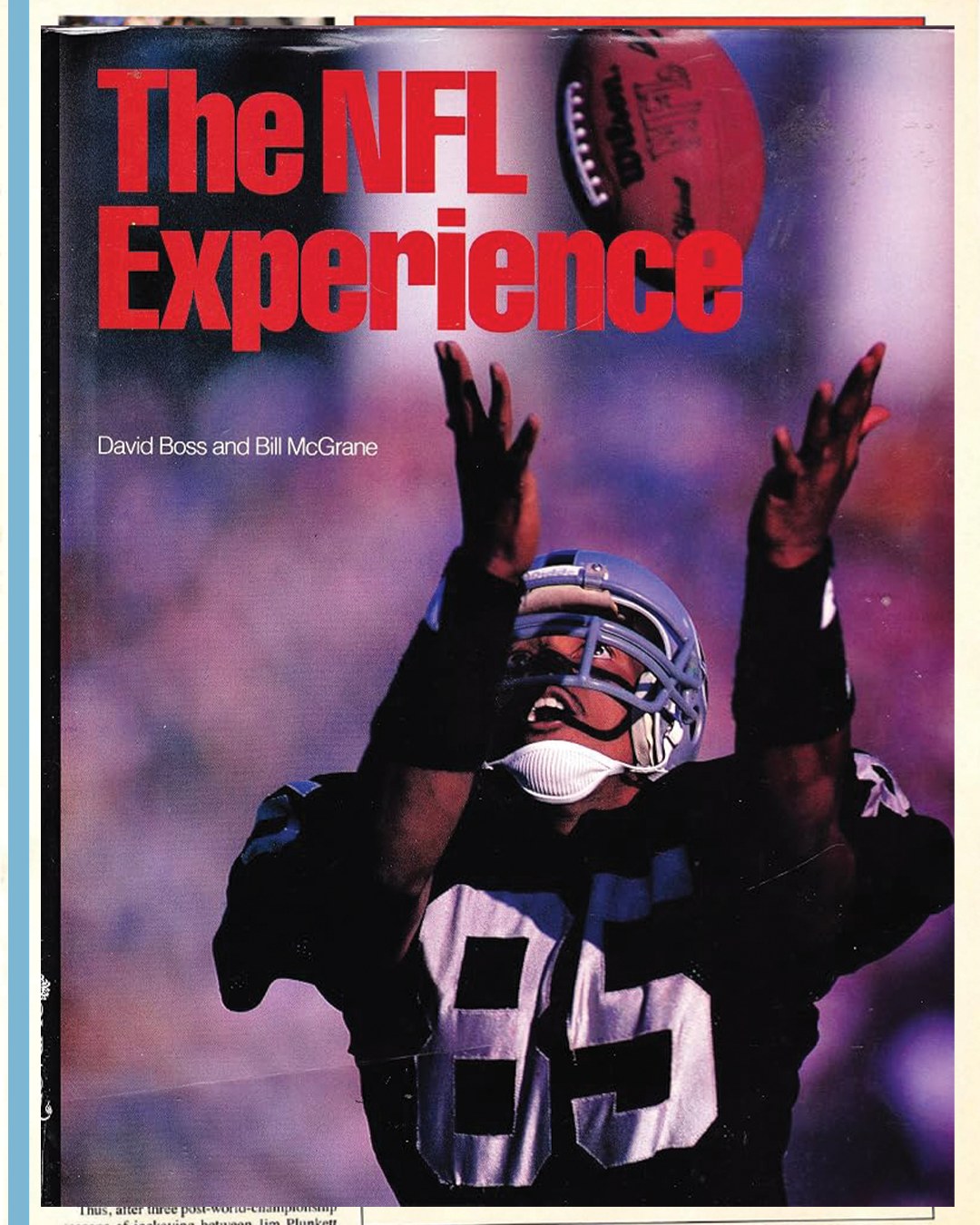 Cover of The NFL Experience by David Boss and Bill McGrane, showing a receiver in a black number 85 jersey reaching up for a football.