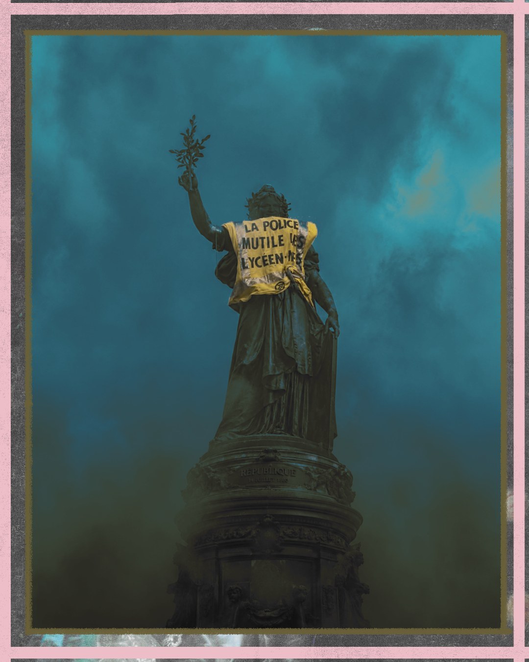 The Marianne statue at Place de la République against a smoke-filled sky, a yellow vest tied across her shoulders reading: la police mutile les lycéen·nes.
