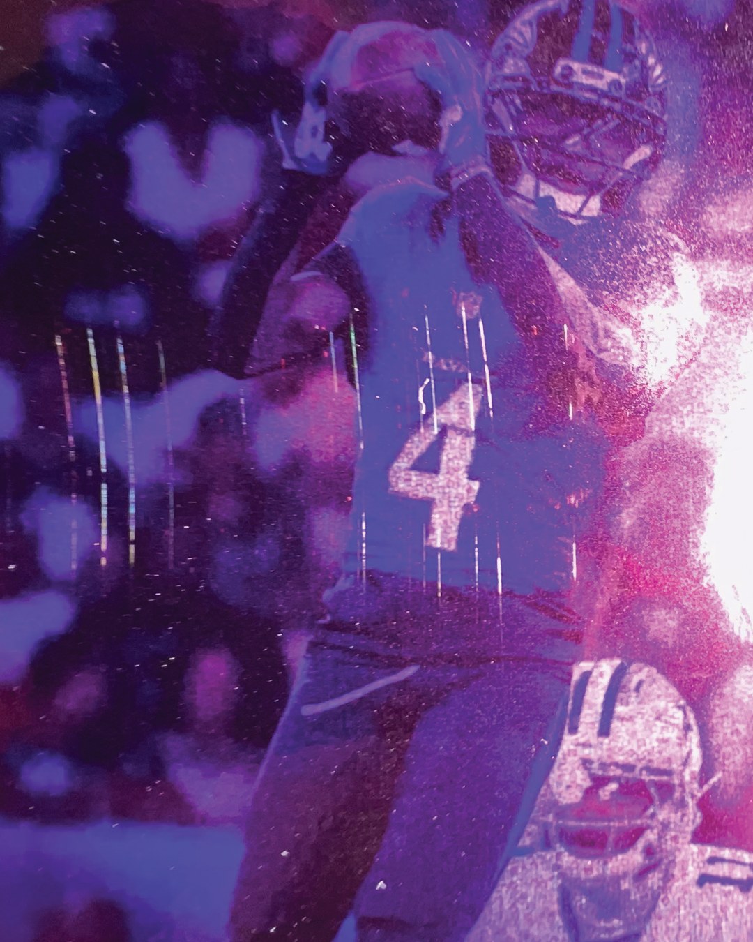 A Ravens receiver in a number 4 jersey reaching up under stadium lights, printed in heavy purple and magenta grain.